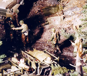 The wounded soldier atop the jeep is from DML's German medical corps set.